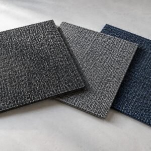 Illustrative grey, charcoal and blue carpet tile samples
